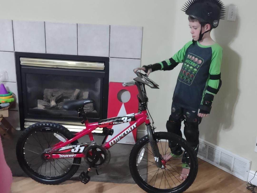 Ethan got a bicycle for his Birthday along with safety gear. He out grew his old bike that had training wheels on it