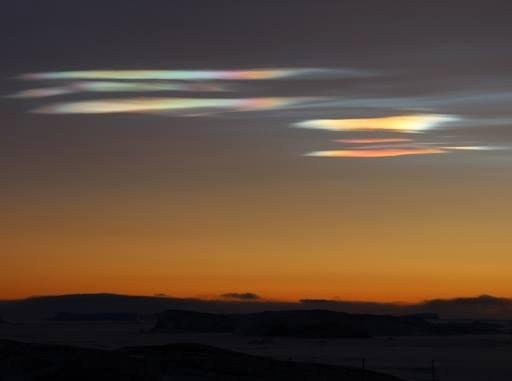POLAR STRATOSPHERIC CLOUDS: Bright colors have appeared in the skies over Antarctica--but it's not the aurora australis. Instead, pastel stratospheric clouds are floating over the frozen continent. B. Sudarsan Patro photogr