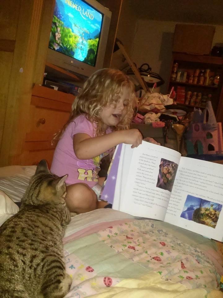 Kay is reading Ariel a story