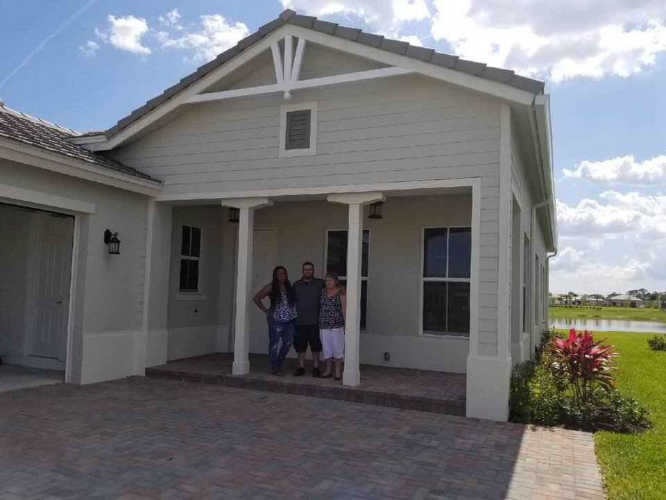 Excited first time home buyers and their mom. One can find great value with a home purchase in Ave Maria, a developing region around a university.
