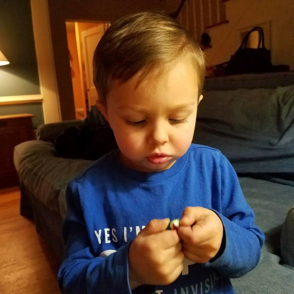 He's inspecting a candy cane.