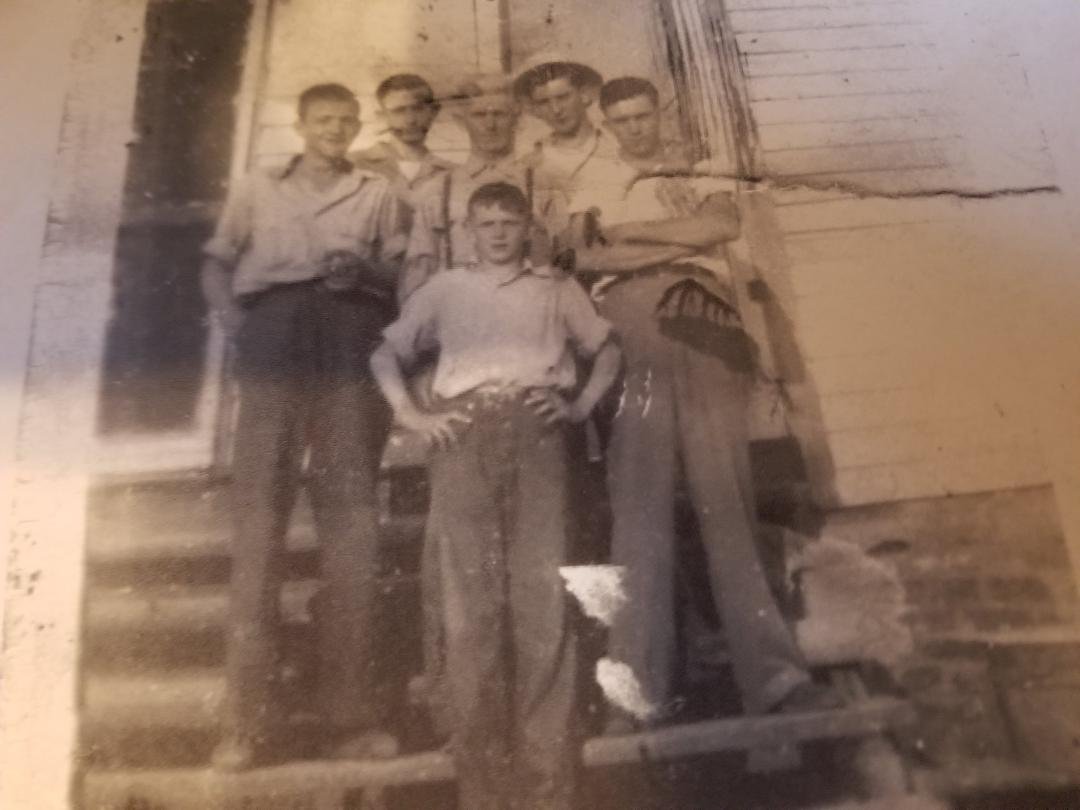 my Paw Paw McCreless and his sons my dad is there  some time in early 1930s Alabama