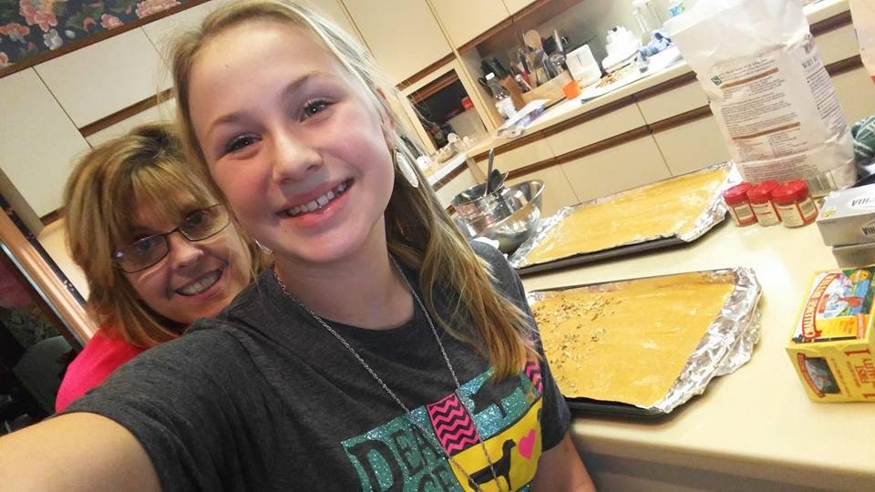 Baking pumpkin rolls with my beautiful granddaughter Kyler.