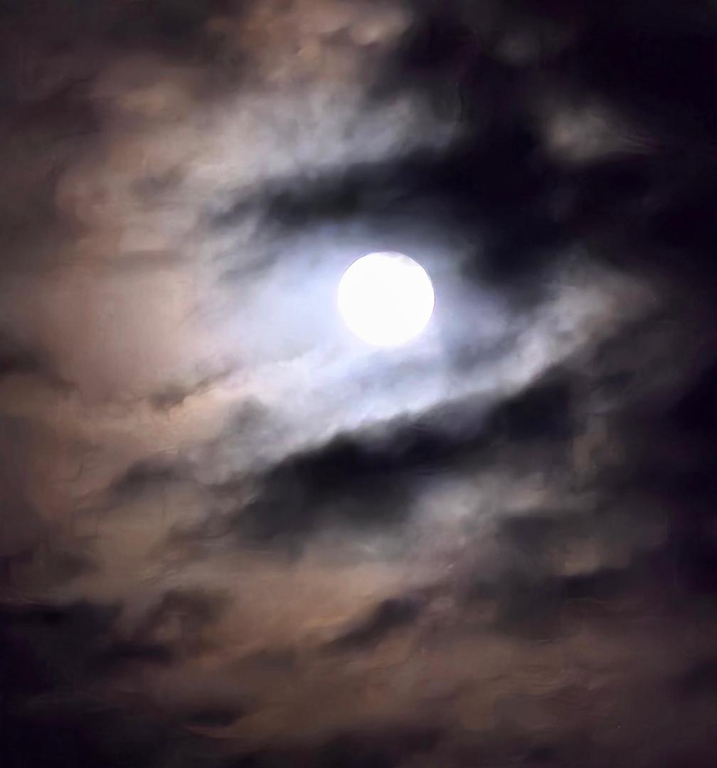 Eery full moon with cloudy sky last night.