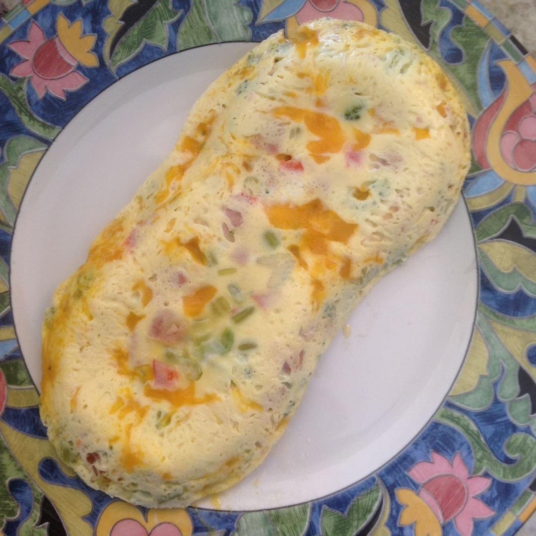 I really had a good time at the Tupperware party. Thanks for inviting me. Here is my first omelet from my new Tupperware omelet maker.