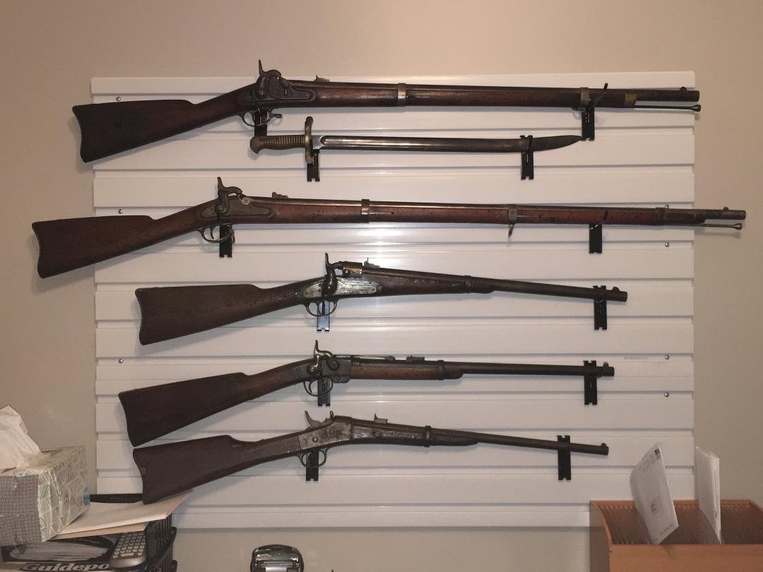 The Wall
(top to bottom): Harpers Ferry with Sabre bayonet; Springfield with bayonet; Joslyn; Smith, Poultney and Trimble and a Remington Rolling block.