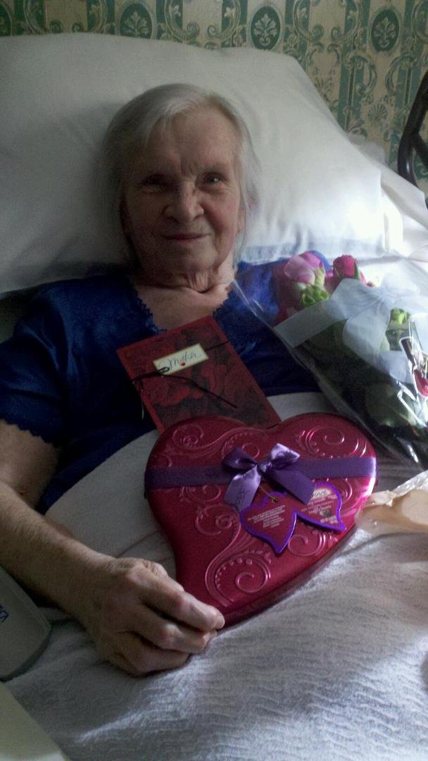 This is a picture of Mom with her VALENTINE'S DAY surprise from my sister and me. She sure was surprised when I came in the room early this morning singing - lol!