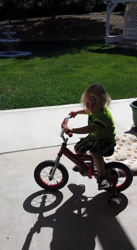 Great grand baby Dakotah on his bike