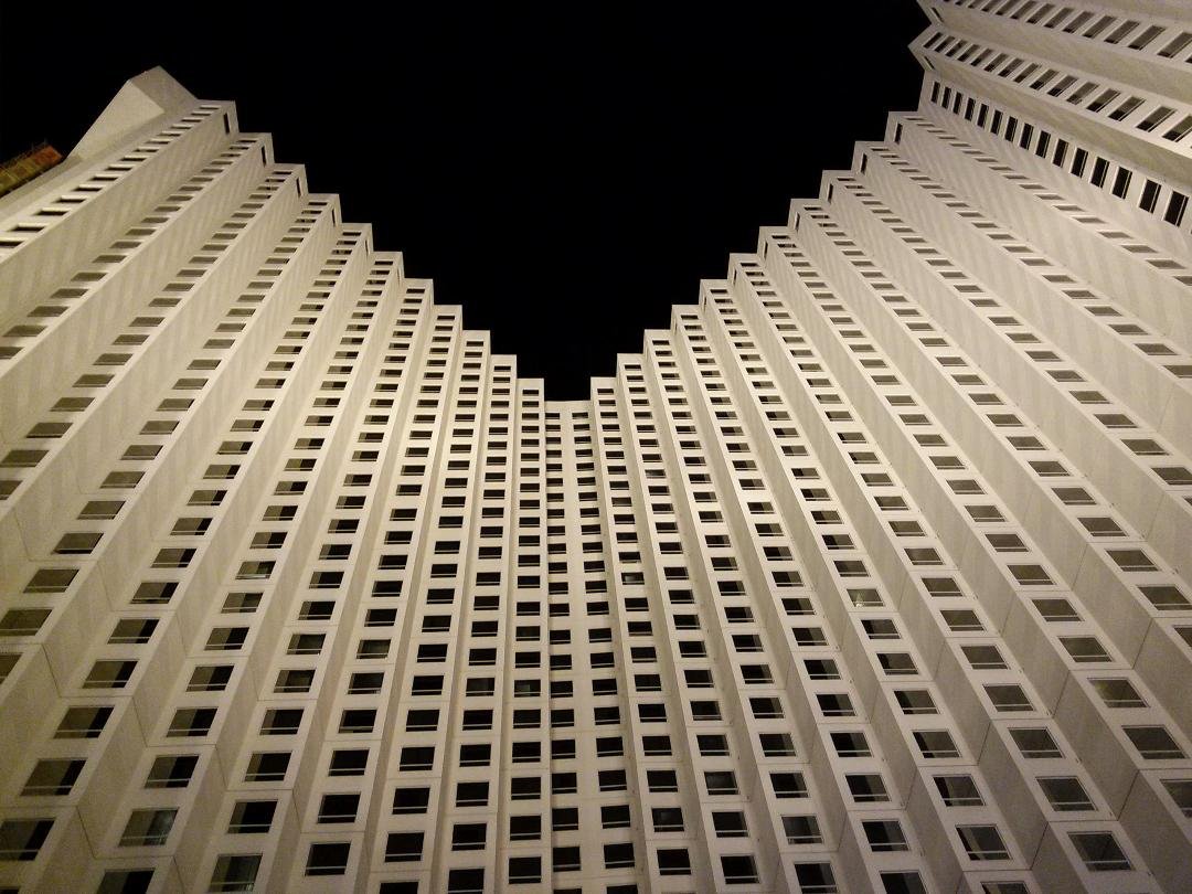 Optical illusion! Looking up at Harrah's Hotel, Las Vegas, NV, from the valet pickup area. Impressive eh? Hint...the building is one height.
