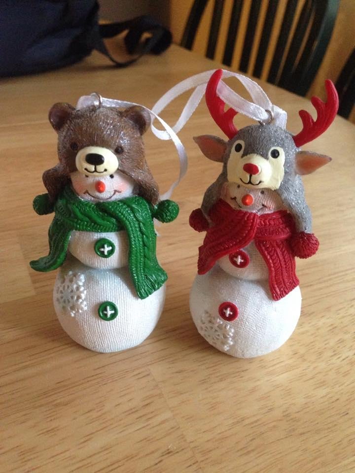 Snowman shopping has started. The first purchase of the season. Snowmen wearing critter hats!!
