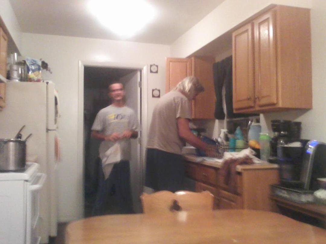 Travis  and  grandpa  doing  dishes