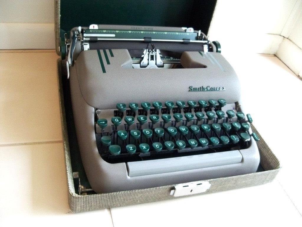 Identical to my mom's Smith-Corona "portable" typewriter (shown here in its travel case).