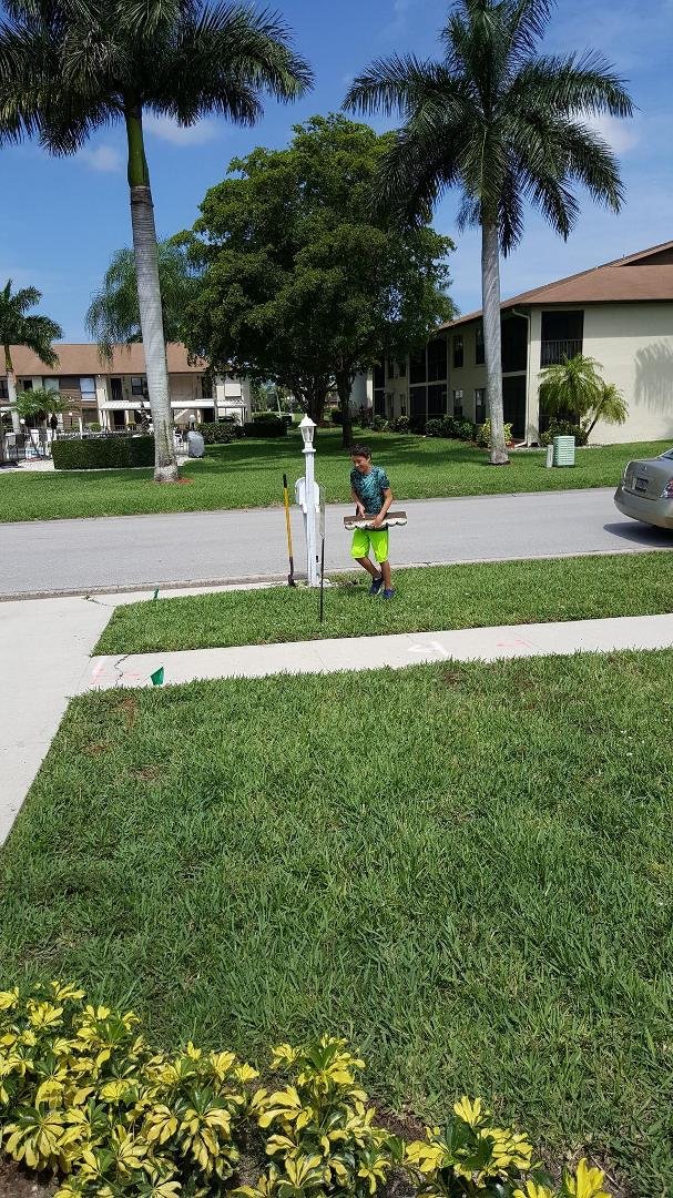 Evan working hard helping grampa