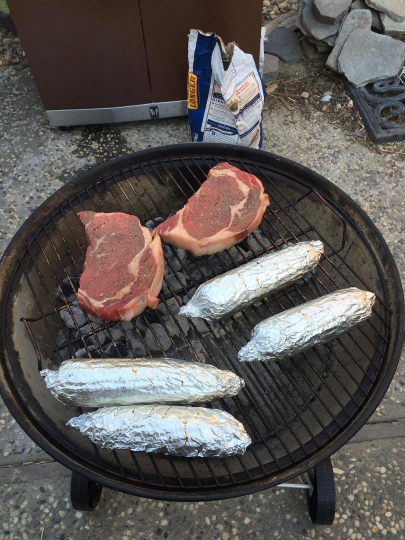Dip in the pool . Ribeye and corn!