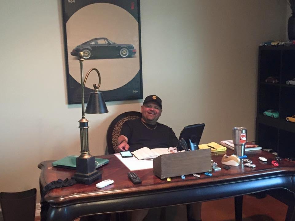 My friend Rudy hard at work at his toy box. 32 great Porsches and a prize BMW.