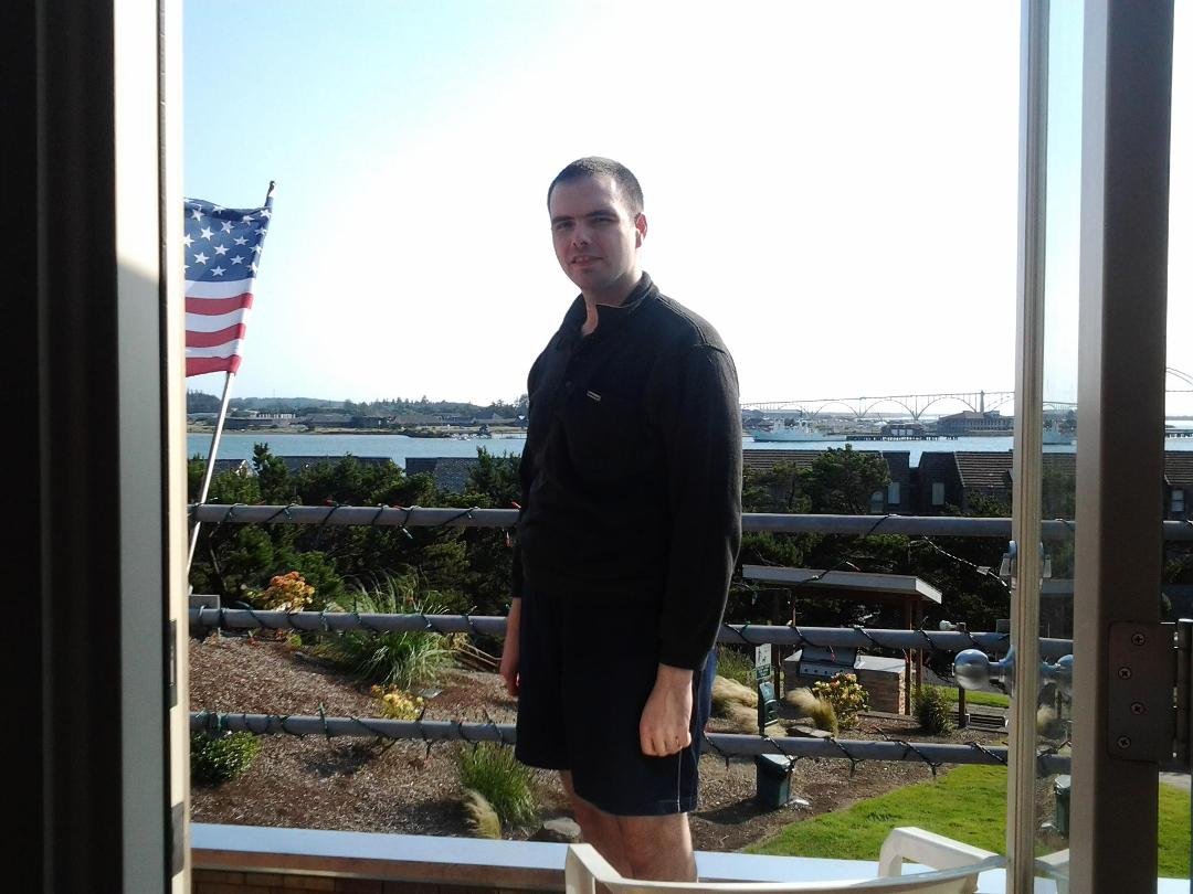 my tall single goodlooking son Matt on our deck in NewportOregon computer guy.