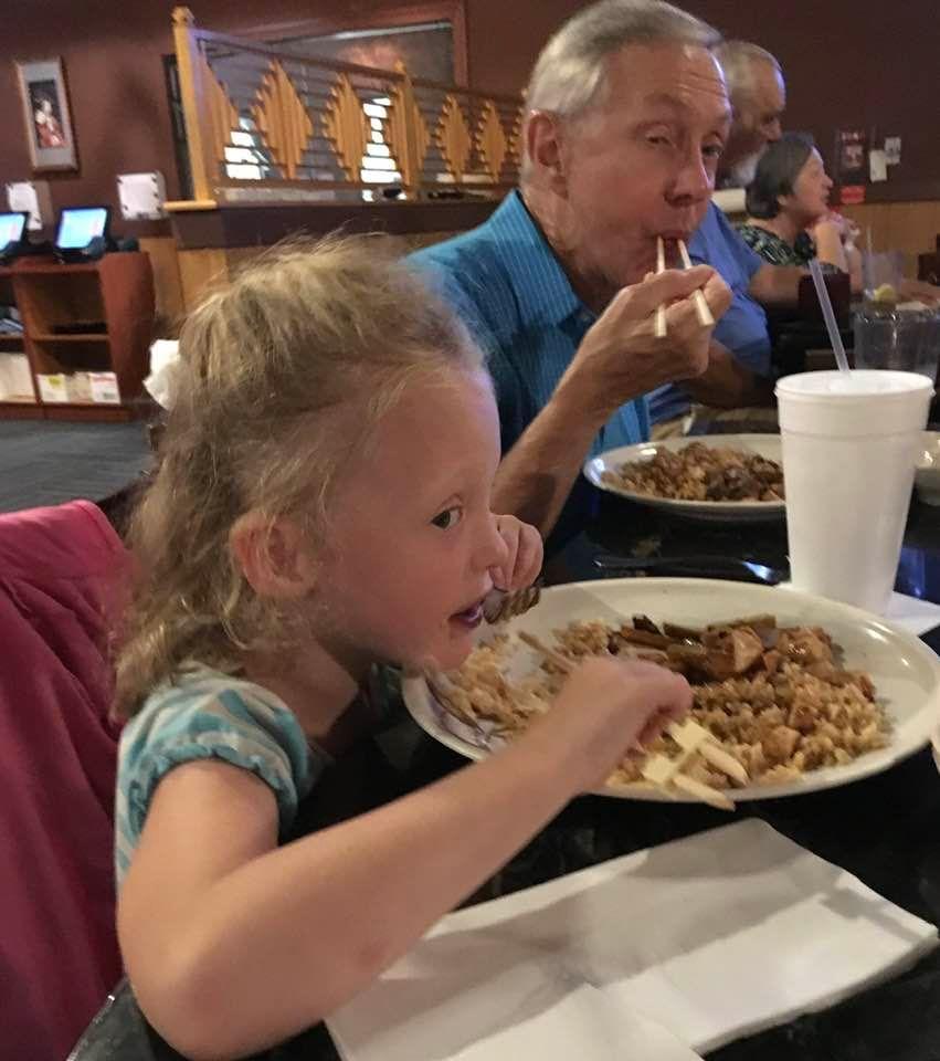Lacie and Grandpa at Japanese Steak House, several years ago.