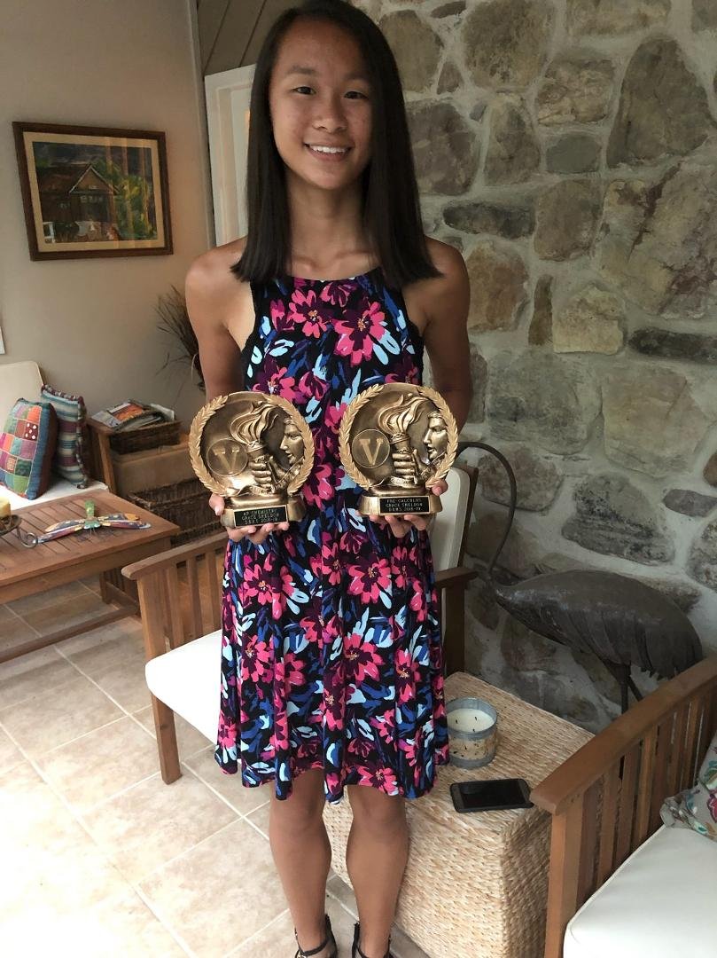 My youngest awards for AP chemistry and pre calculus --- I guess that I am a proud father