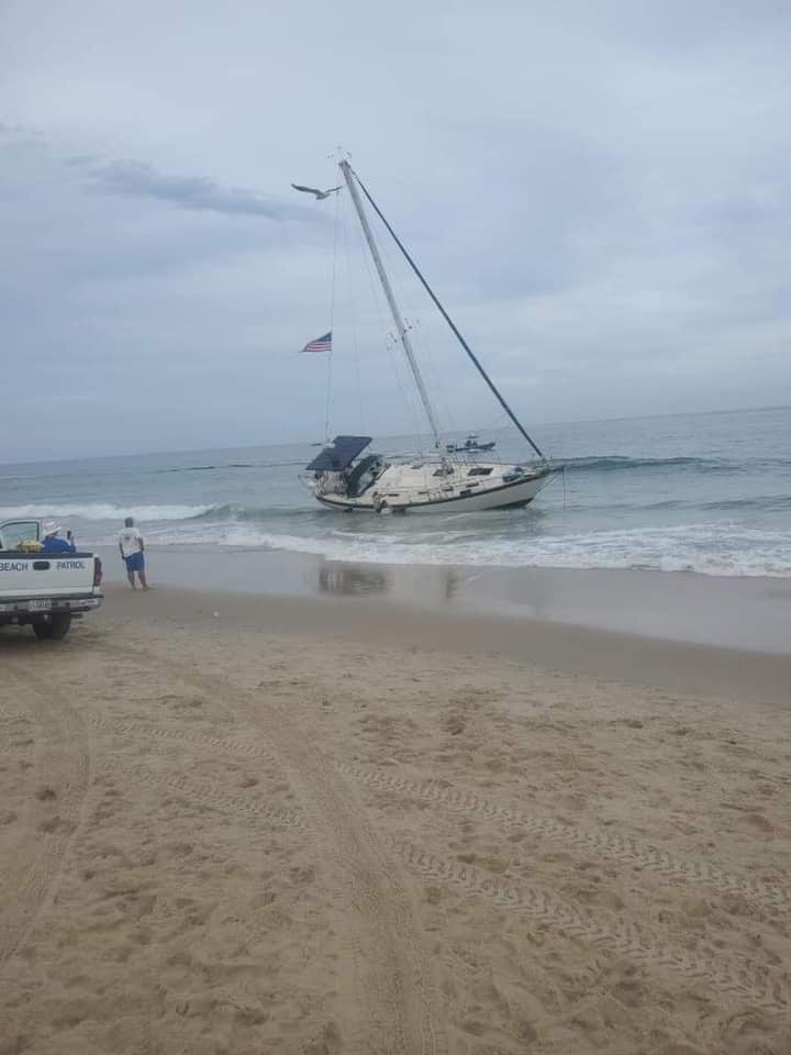 Yesterday evening at inlet in Ocean City, my daughter snapped this pic of sailboat washing ashore. She said it happened really quick.