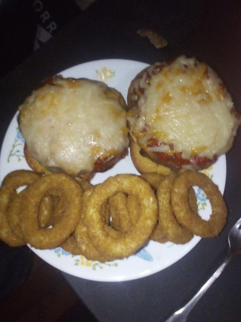 Grilled Pizza Burgers served on Garlic Bread
 with air fryer Onion Rings for dinner tonight!! Yummy!!
