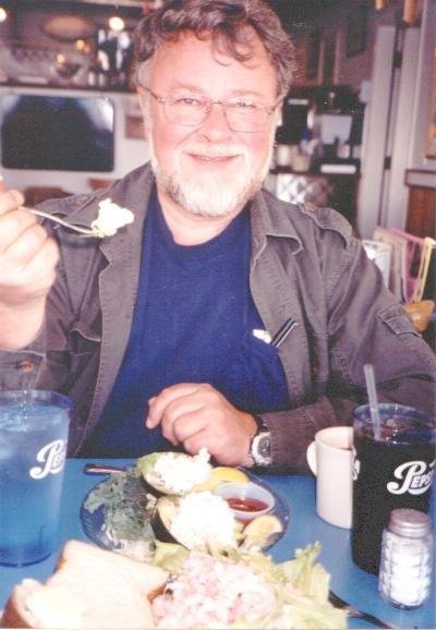 Bob gobbling shrimp stuffed avocados at Mo's in Newport.