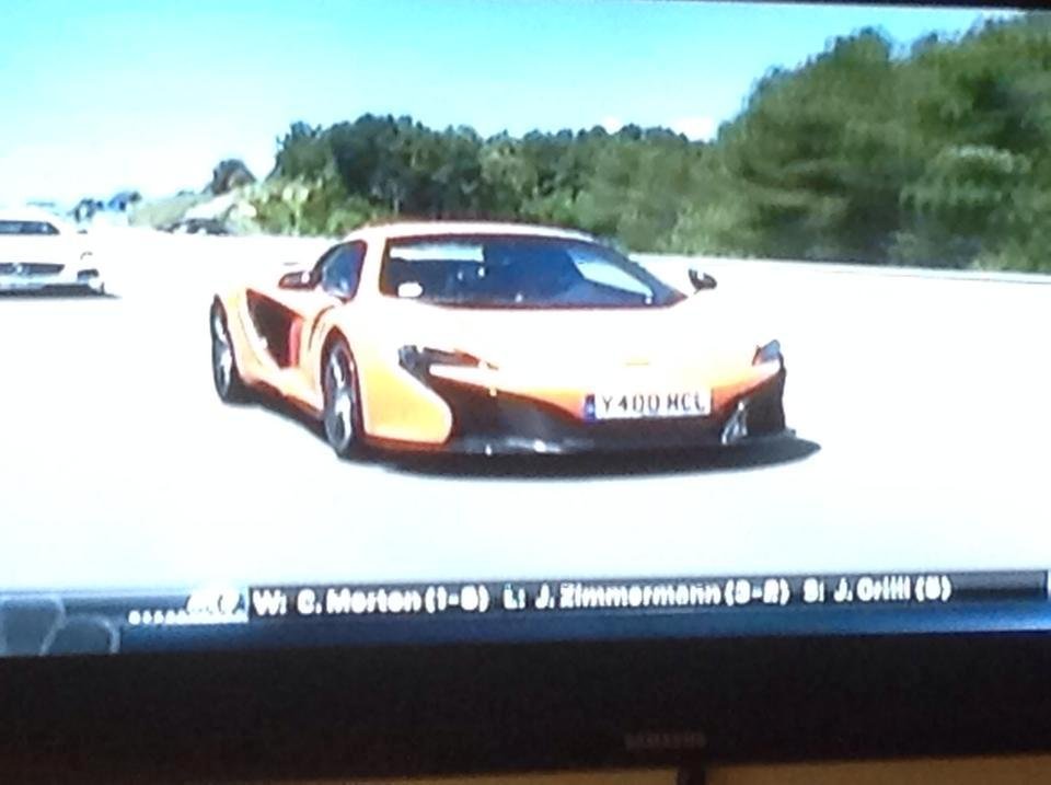 Bad photo taken from the TV... but Jim just told me that this was the kind of car that he beat for Best of Show at a recent car show. The vehicle he had? 67 VW bus! This is a McLaren 650.... What a hoot!