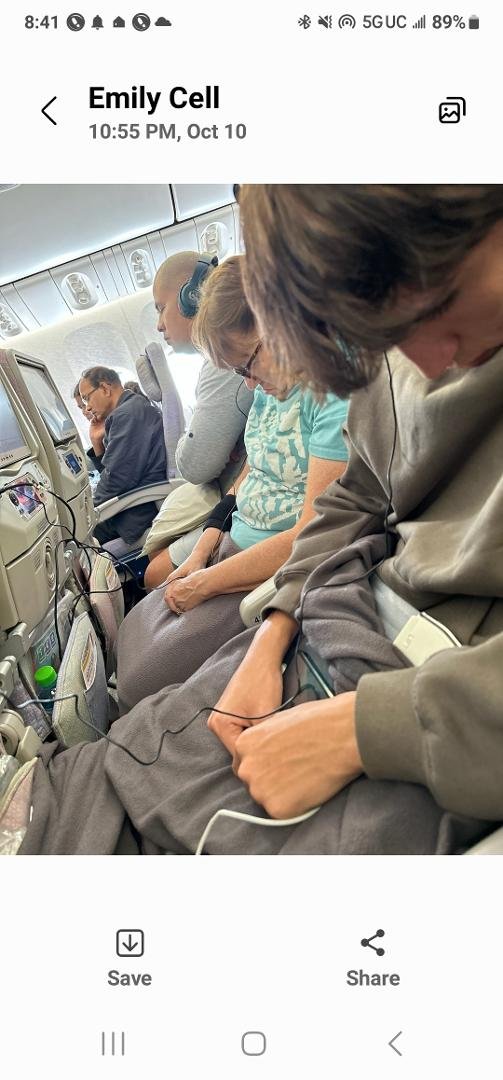 Emily, Nathan, and Pam will land at Chicago this afternoon, 10-11.
She sent me this photo from the airplane. I asked her if the seats reclined? She said "yes, but we haven't takenoff yet".