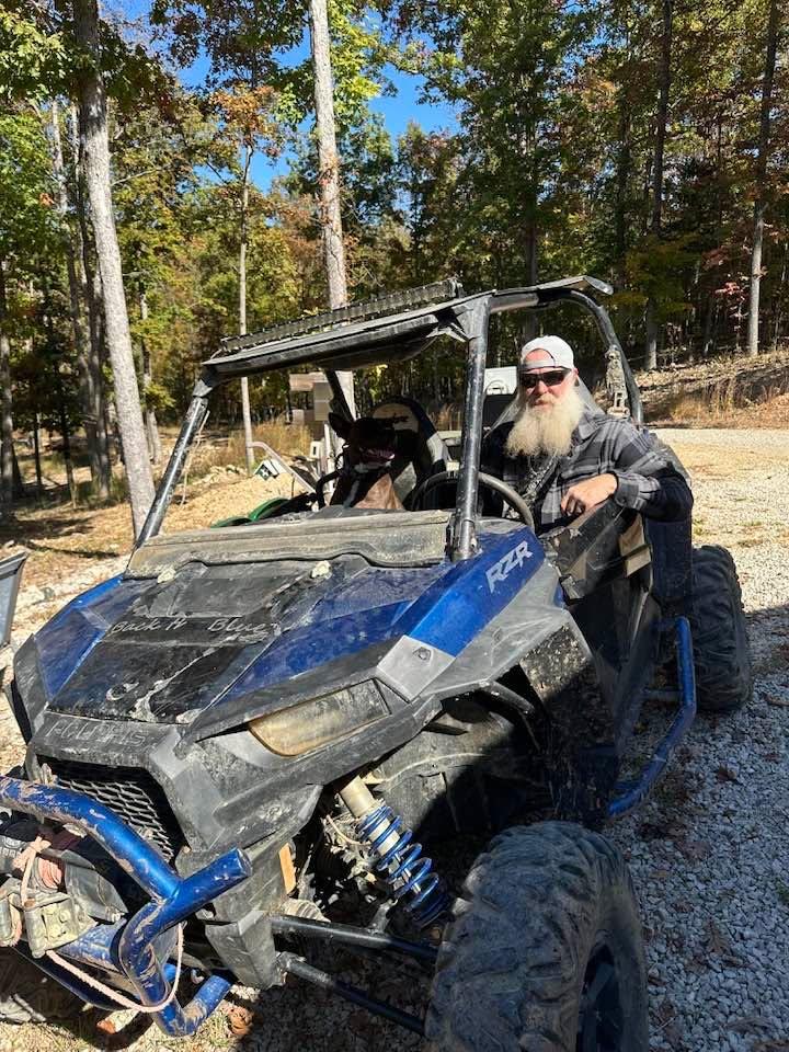 A man, his dog and his new toy.