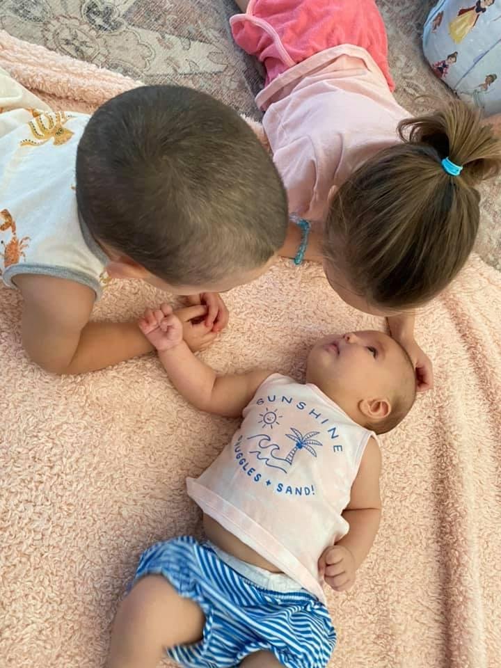Big brother, Leo and it looks like Aunt Emma are bonding with Charlotte.