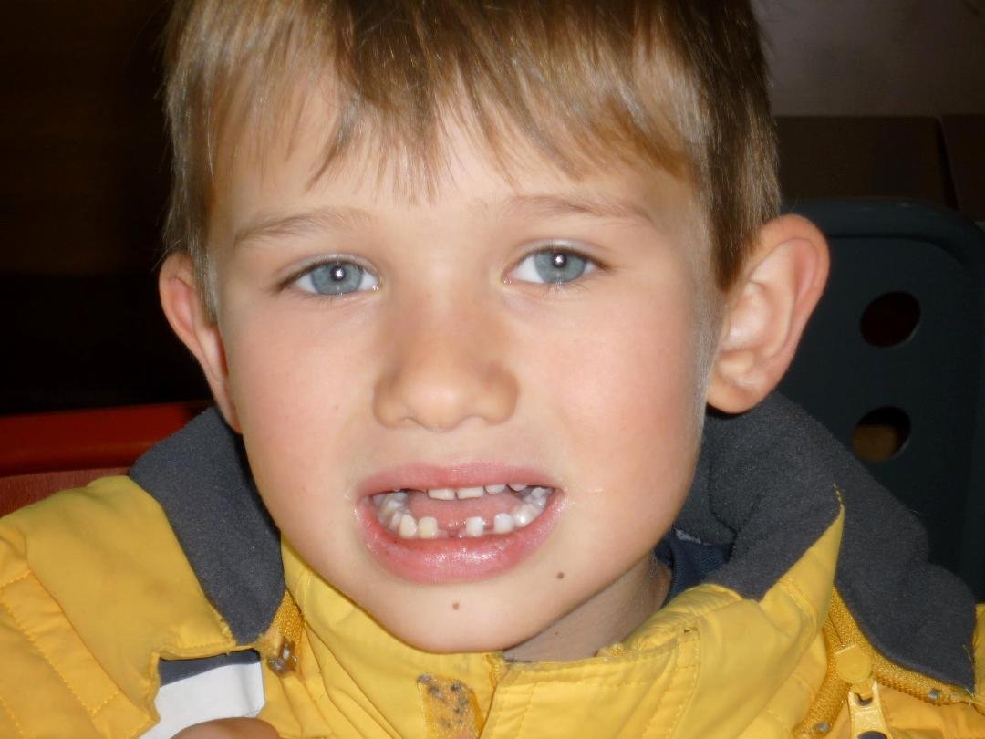 Alexander lost his first tooth today...while he was eating a "cupcake on a stick" at Starbuck's!