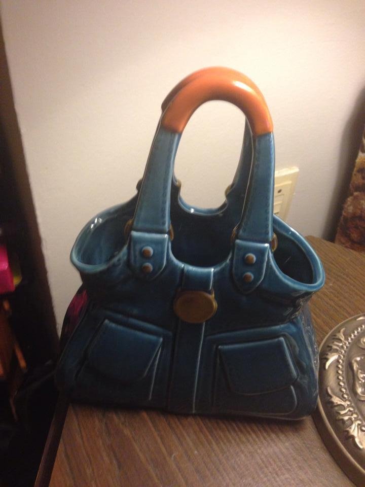 Had a great time at the bowling banquet last night! Came home with $79.00 and a vase in the shape of a purse! By the time, my number was called for the door prizes, not much was left but the vase is cute!