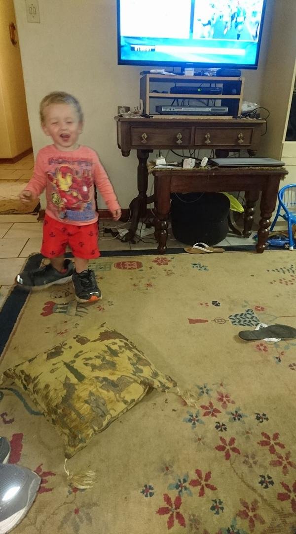 Trying on dad's shoes