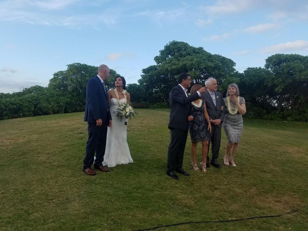 The bride and groom with parents.
