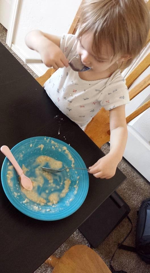 Maddy eating her oatmeal, needs at least 2 spoons!
