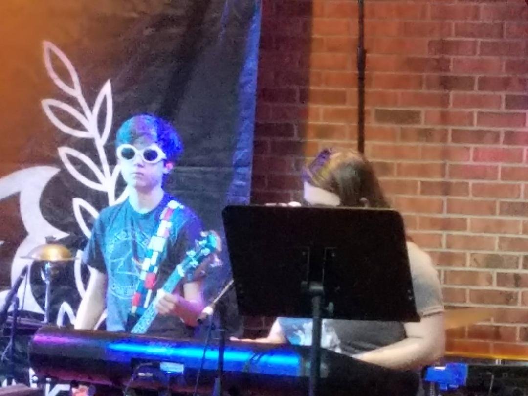 When your 13 year old is rocking at the Pittsburgh Hard Rock Cafe. Not sure about his choice of sunglasses..