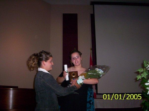 Ashley presenting Kim her flowers.