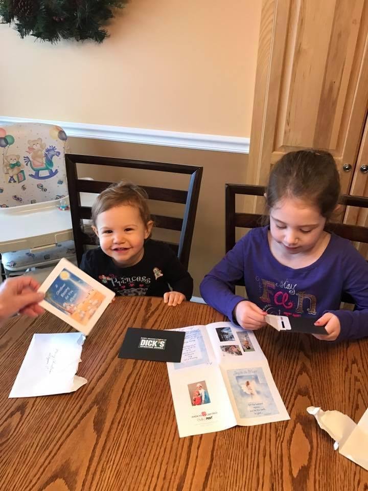 Ava and Allyson opening their presents from Jan and Gary Clifton Lees