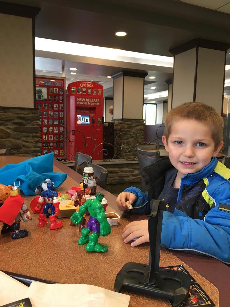 After a busy morning of basketball, car racing, play dough and coloring time for lunch!! The chicken nugget kid !!!