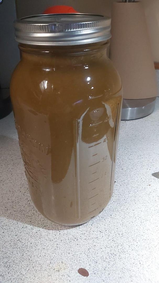 This is about 60 ounces of pure hot sauce, and its hot. I saved the mash from the other hot sauces to make this one. This particular brew has mostly jalapeños, green thai chilies, finger green peppers, and to bring on the