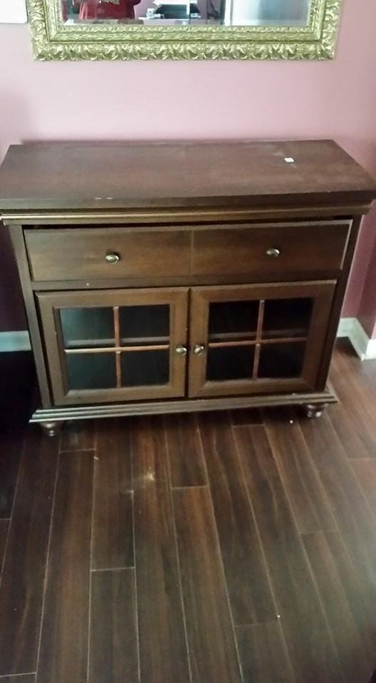 Wood entertainment center it holds a 60 inch TV just asking only $150.00