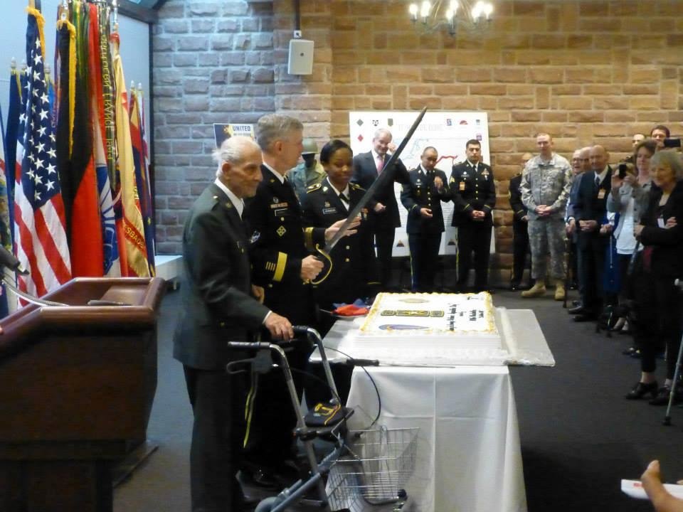 The oldest and youngest cut the cake with LTG Campbell