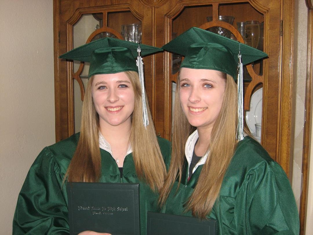 You are not seeing double.  They are my granddaughters in their cap and gowns following graduation from Edmond's Santa Fe High School.  As much as I liked math, they like it better including science as will plan on majoring