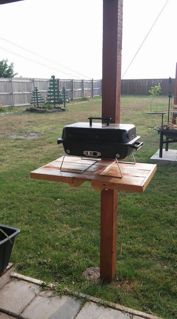 I made this today. It's a stand for the small bar b que for when it's just the two of us. It folds down when not in use. The big bar b que is in the back for when the family comes over.