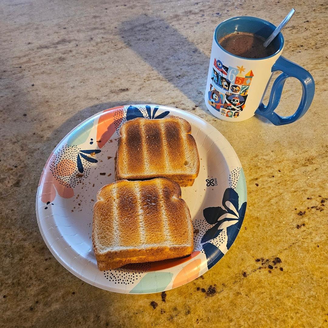 One of my favorite treats from childhood. Hot chocolate, and toast with real butter.