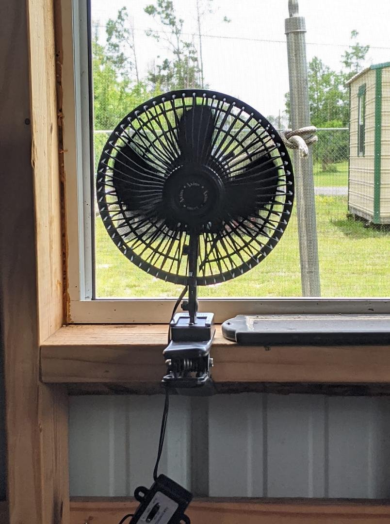 My newest addition to the pole barn.
12v automotive fan hard wired into the solar charge controller.
Even on its lowest speed, it puts out a nice breeze.
