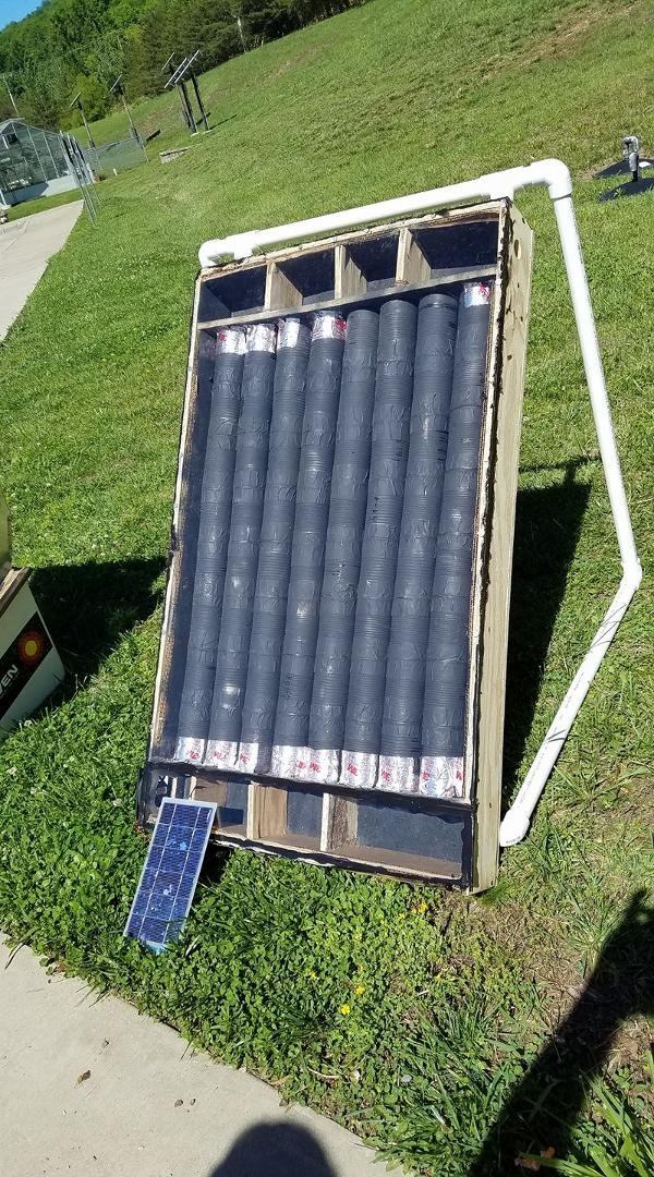 This is a solar room heater powered with a scrapped computer fan. The heating elements are recycled tin cans. The highest temperature on our first test today is air heated to 188 degrees. Not bad at all for a group of 8th g