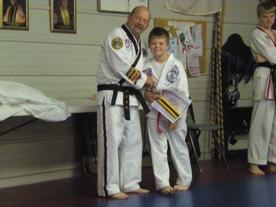 Ryan getting his Yellow belt. May 20, 2013