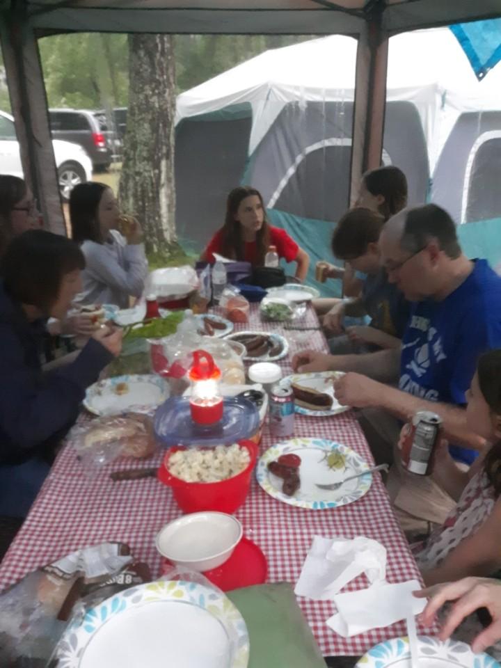 Eating inside the screen tent away from the rain