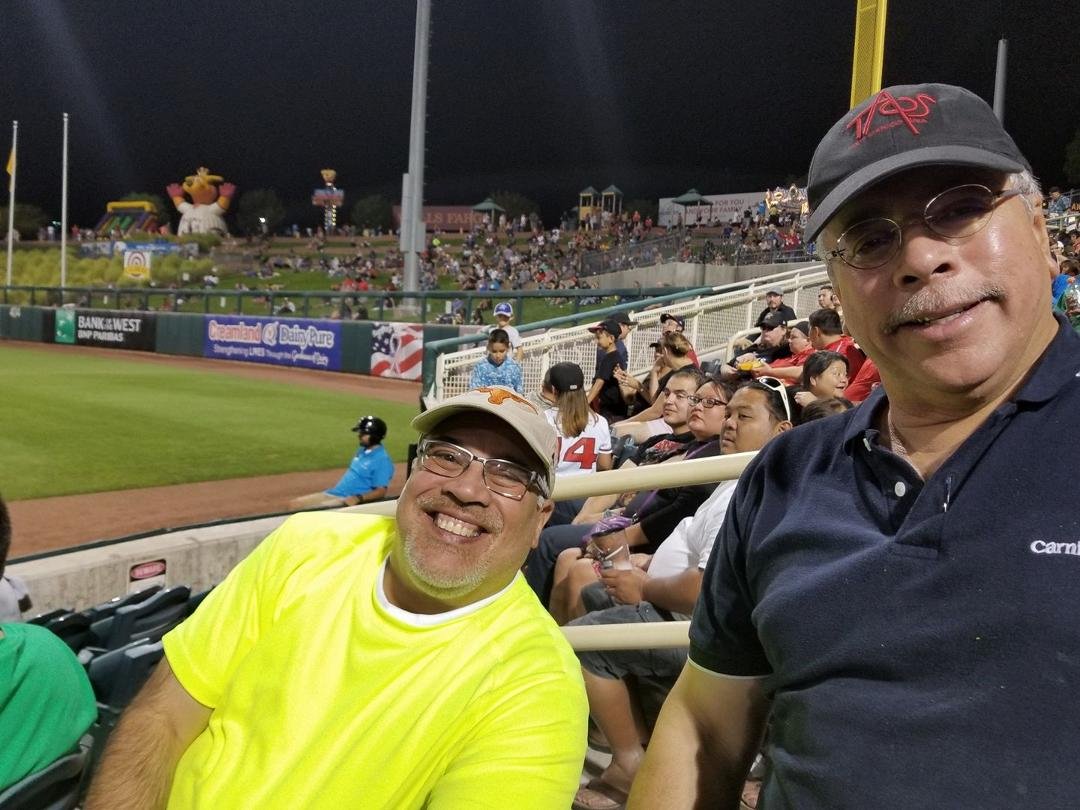Mario and Oscar at baseball game