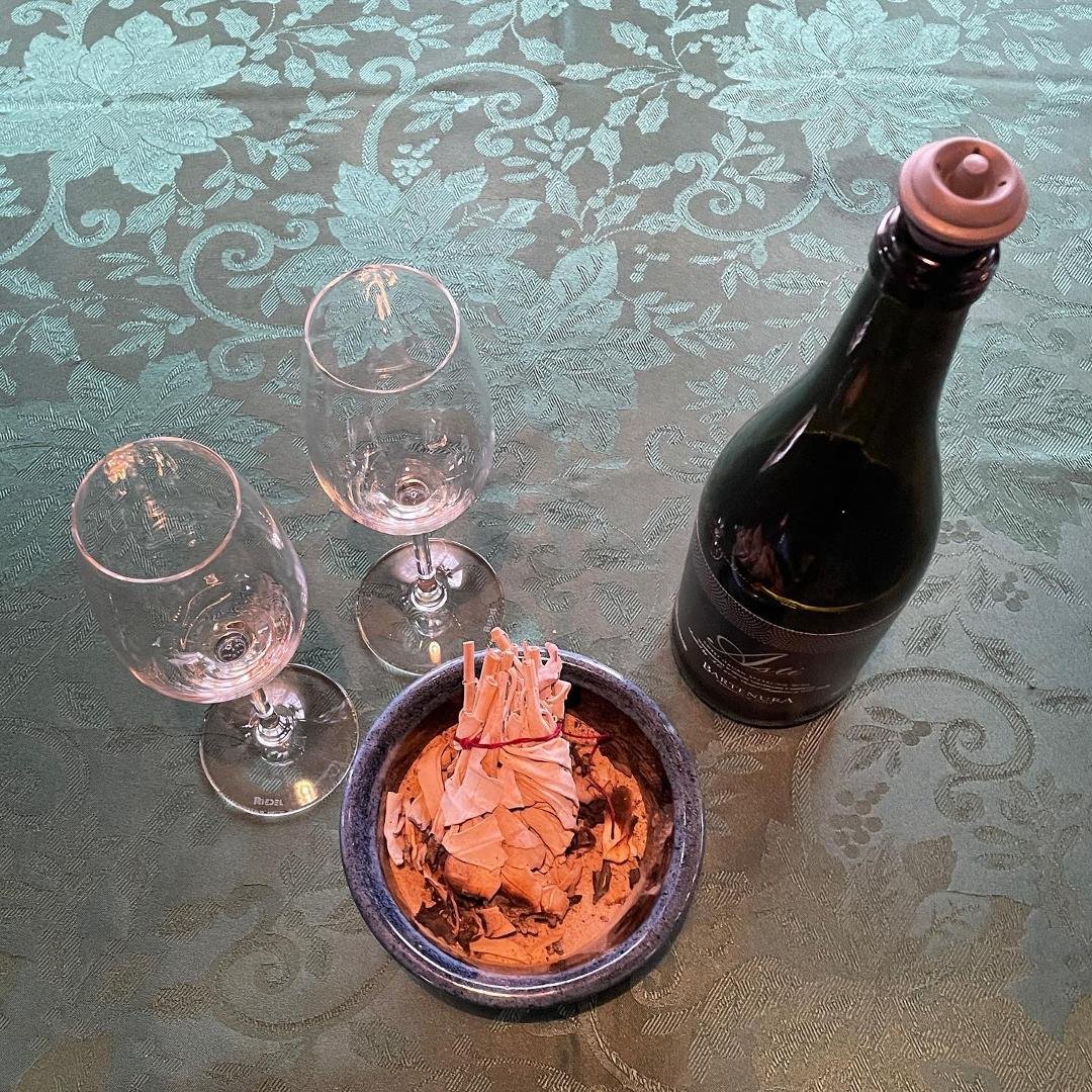 Our Inauguration kit: a bottle of Asti, two glasses, and sage for smudging. Begone, evil spirits!